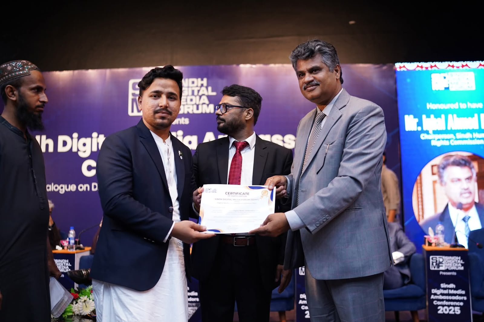 Syed Qadar Shah receiving a certificate at a Sindh youth and sports event