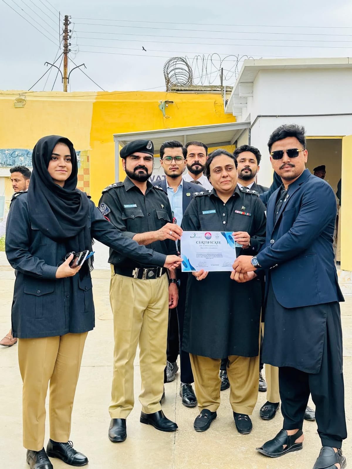 Syed Qadar Shah receiving recognition with representatives of Sindh Police